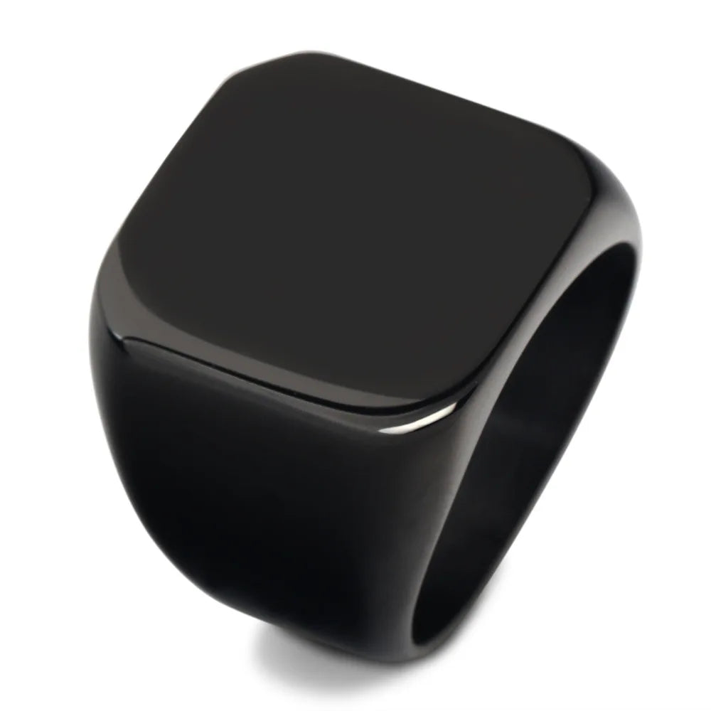 A glossy black square stainless steel ring viewed from above.
