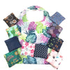 A colorful foldable floral shopping tote with multiple patterned fabric pouches.