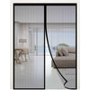 A modern interior view through a glass door with a fine mesh screen for mosquito protection