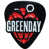 A black pin featuring a red pineapple design and the name GREENDAY in white text.