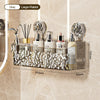 A wall-mounted storage basket with a gold and silver water ripple design holding various bottles and tools.