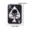 Black embroidered iron-on patch featuring the letter A and a skull design on a triangular shape.
