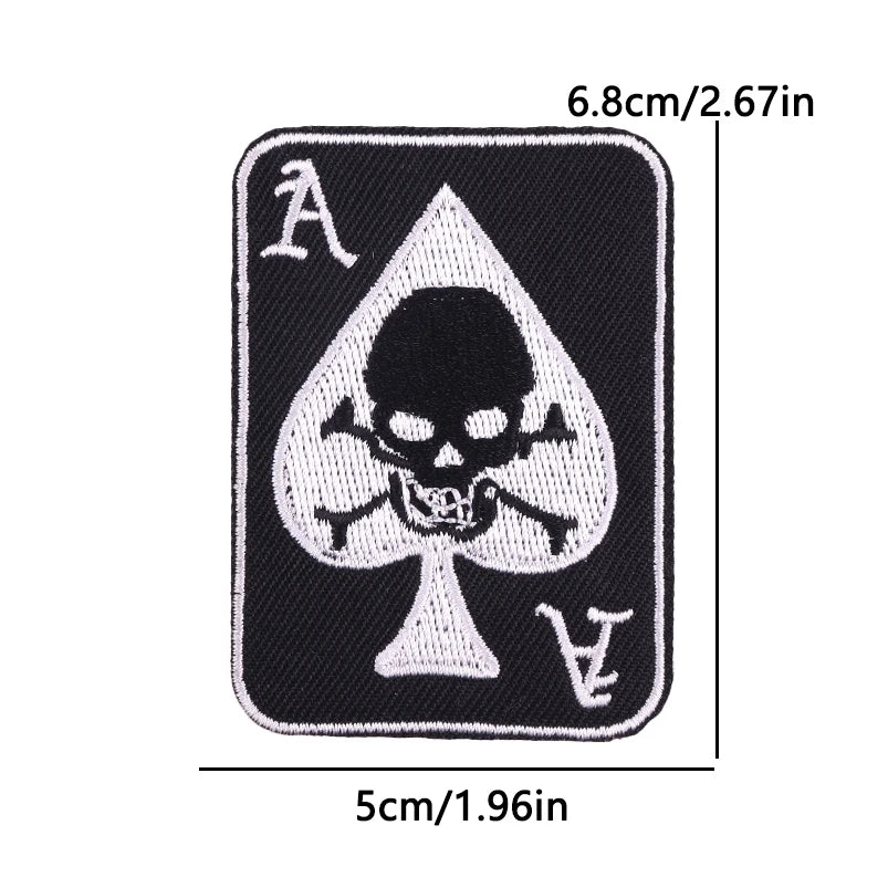 Black embroidered iron-on patch featuring the letter A and a skull design on a triangular shape.
