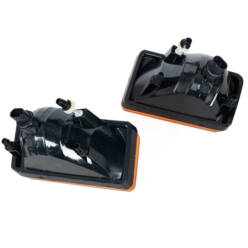 Black direct-fit fog light assembly for Chevy Silverado, Tahoe, Suburban, and Avalanche.
