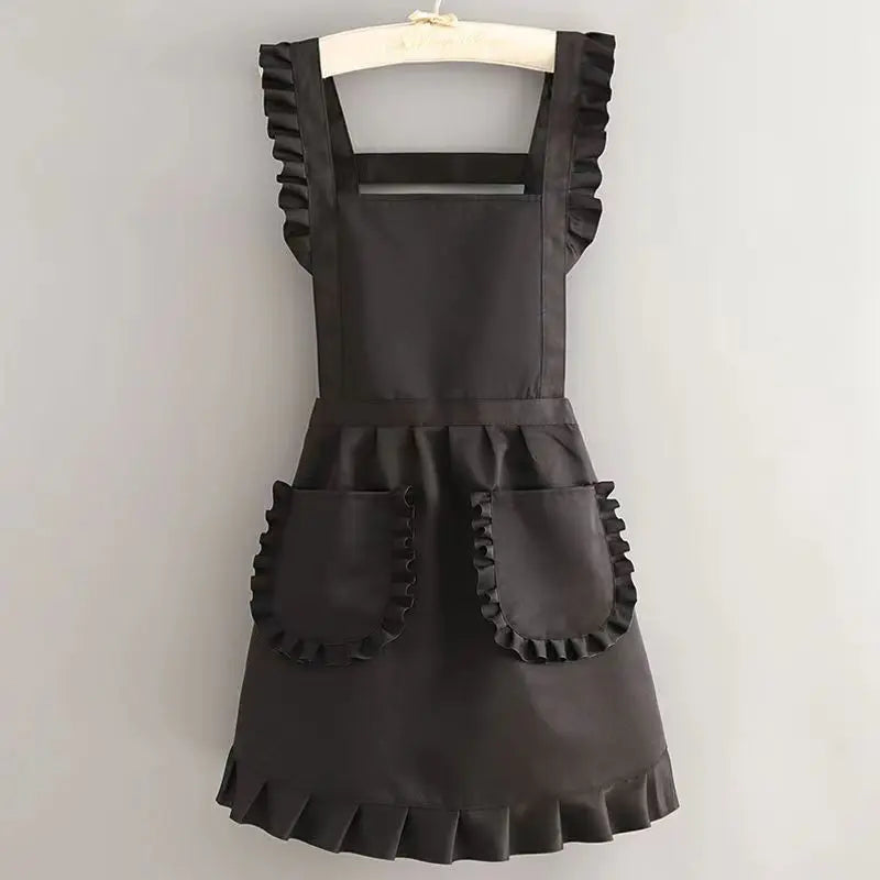 A black Korean style cotton kitchen apron with adjustable neck strap hanging on a hanger.