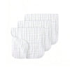A stack of three white extra soft muslin burp cloths with a textured pattern.
