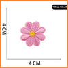 Pink embroidered flower patch with a yellow center, measuring 4 cm in diameter.