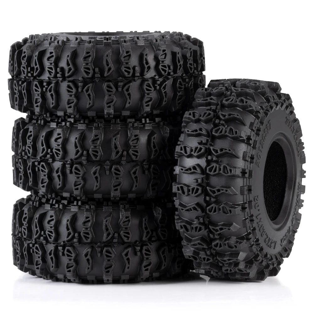 A stack of four black mud terrain rubber tires for RC crawlers.