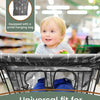 A baby is seated in a shopping cart with a dark fabric cover, demonstrating the universal fit of the seat protector.
