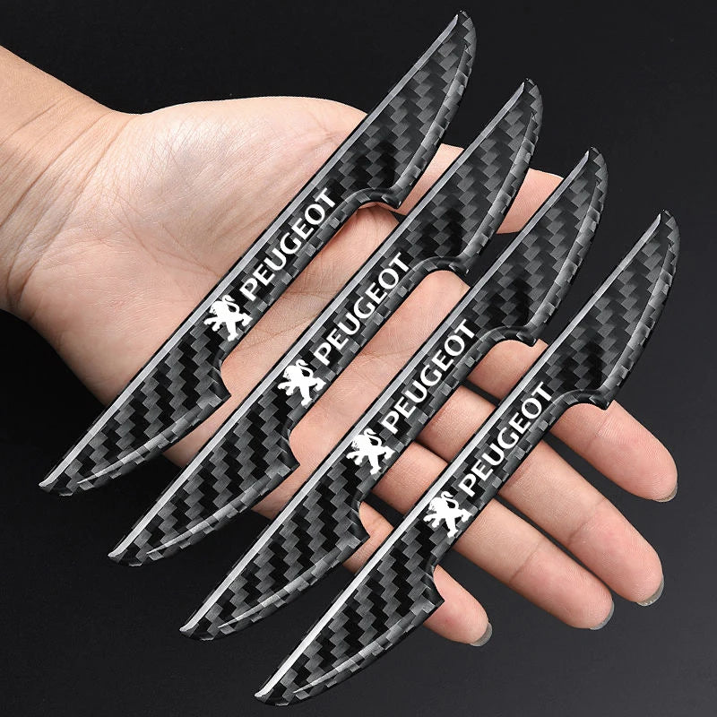 A hand holds several black carbon fiber anti-scratch film stickers for Peugeot car door handles.