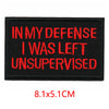 Black embroidered iron-on letter patch with red text that reads In My Defense I Was Left Unsupervised
