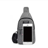 A gray fanny pack designed for carrying a smartphone, featuring an adjustable strap.