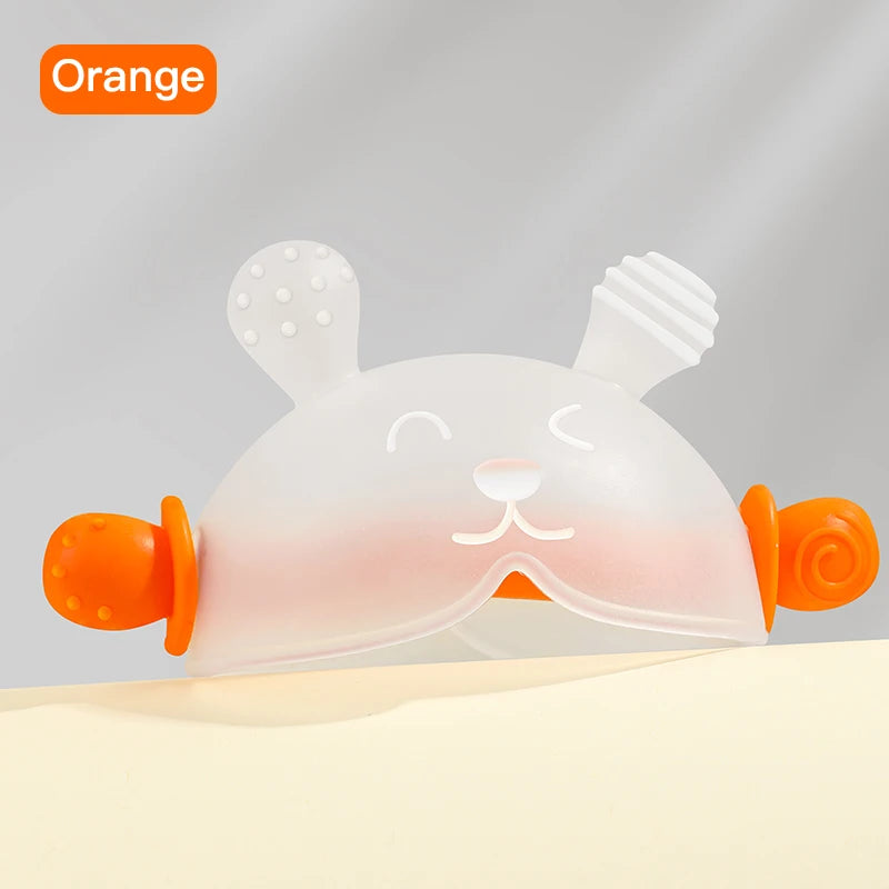A white bunny-shaped baby teether with orange accents is shown against a light background.