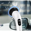 A white electric spin scrubber with a blue brush head is cleaning a window surface.