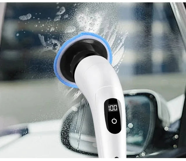 A white electric spin scrubber with a blue brush head is cleaning a window surface.