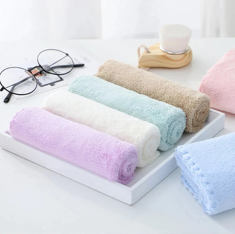 A set of ten ultra-soft coral velvet face towels in various pastel colors, including pink, purple, mint green, cream, and bei