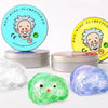 A set of crystal clear stress putty in various colors, including green and purple, with a yellow tin featuring a cartoon man.