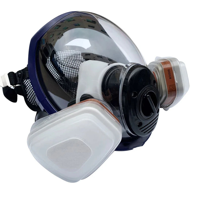 A full face respirator mask with a clear visor and a white protective lens attached.