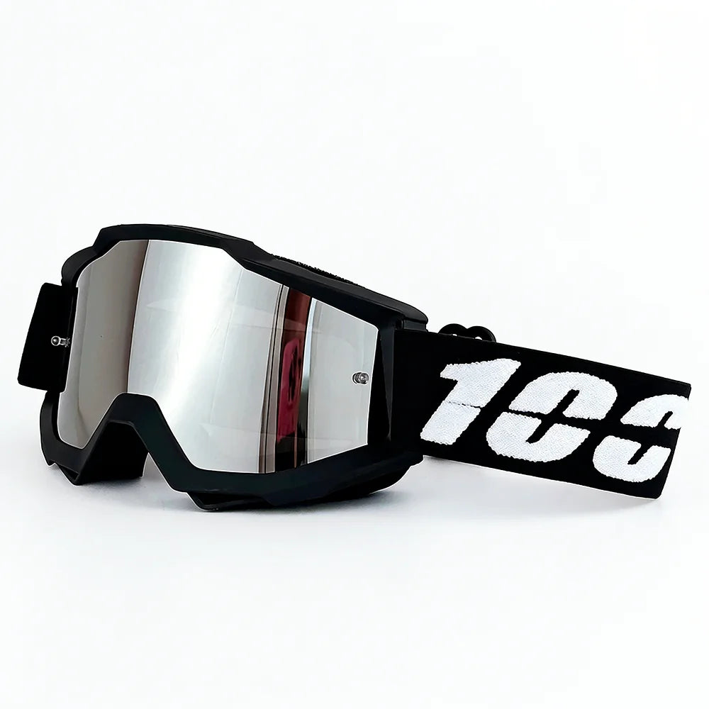 A pair of black off-road motorcycle goggles with a reflective lens and a white '103' logo on the strap.