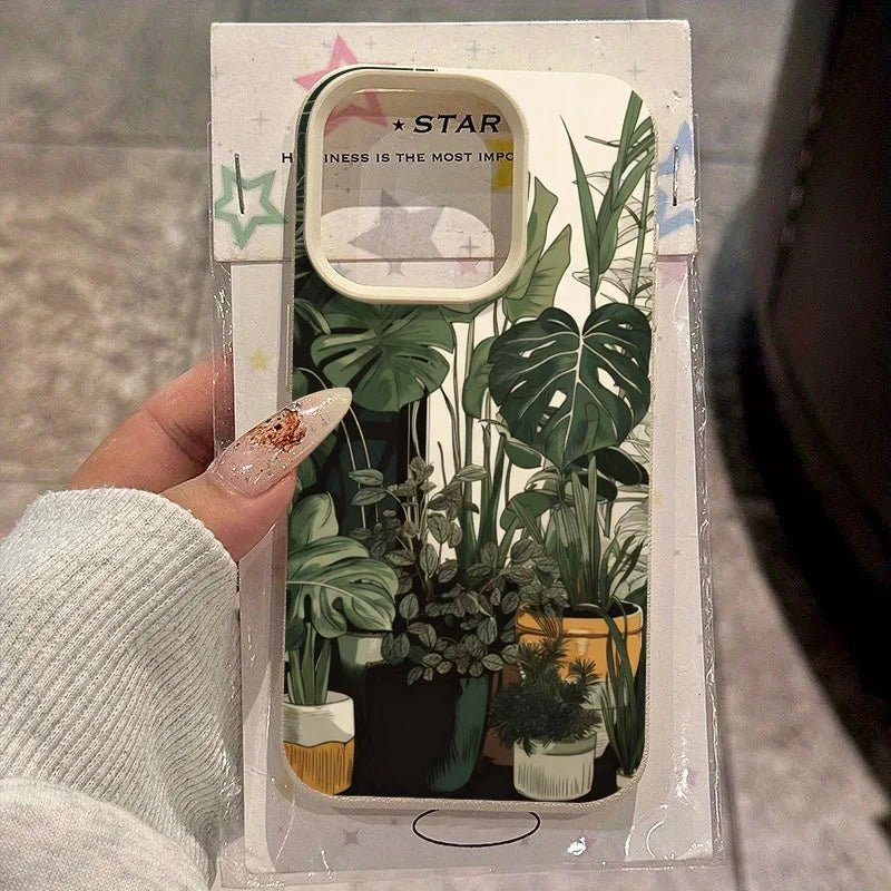 A clear plastic phone case featuring a green monstera plant pattern and a star design.