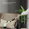 A hand is using a multifunctional wireless electric cleaning brush on a floor, demonstrating its use for household cleaning.