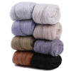 A stack of eight colored wool roving packs for needle felting, showing various shades of gray, brown, and black.