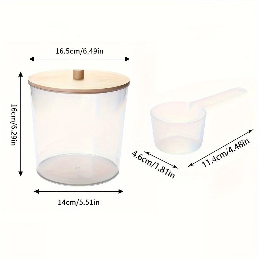 Clear acrylic detergent pod storage container with a lid and a spoon