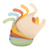 A stack of silicone baby bibs in various pastel colors, including orange, yellow, and green.