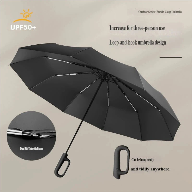 A black loop-and-hook umbrella is shown open, highlighting its rib frame design and portability.