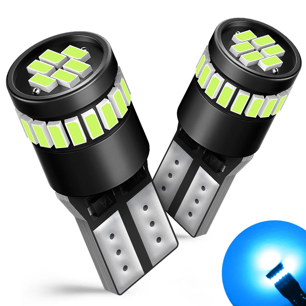 A pair of black LED light bulbs with green illumination and silver bases, showing a close-up view.