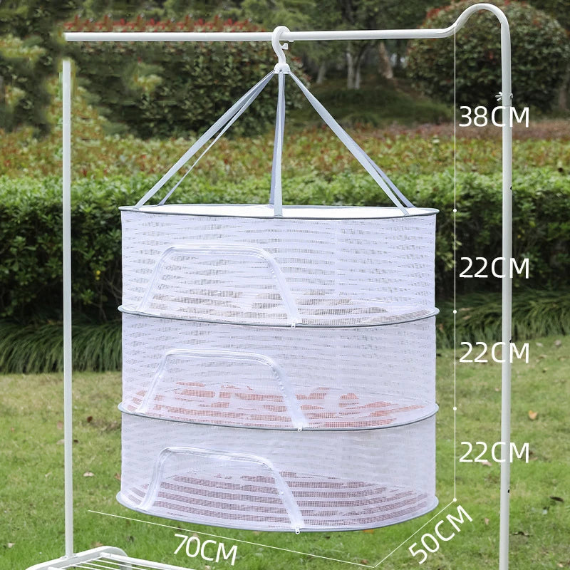 A white folding hanging drying net with mesh protection is displayed on a stand, showing its dimensions.