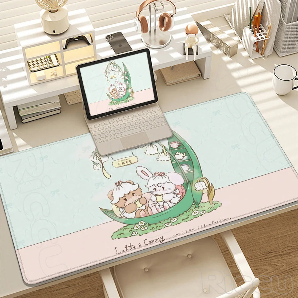 Kawaii Cartoon XXL gaming desk mat featuring cute characters and a green theme on a white wooden desk.