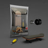 A package containing a wooden finger skateboard, a deck, and wheels.