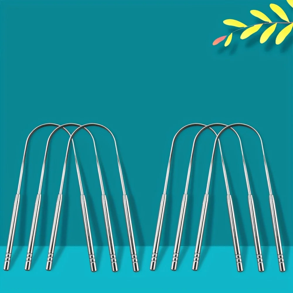 A set of stainless steel tongue scrapers for fresh breath displayed against a teal background.