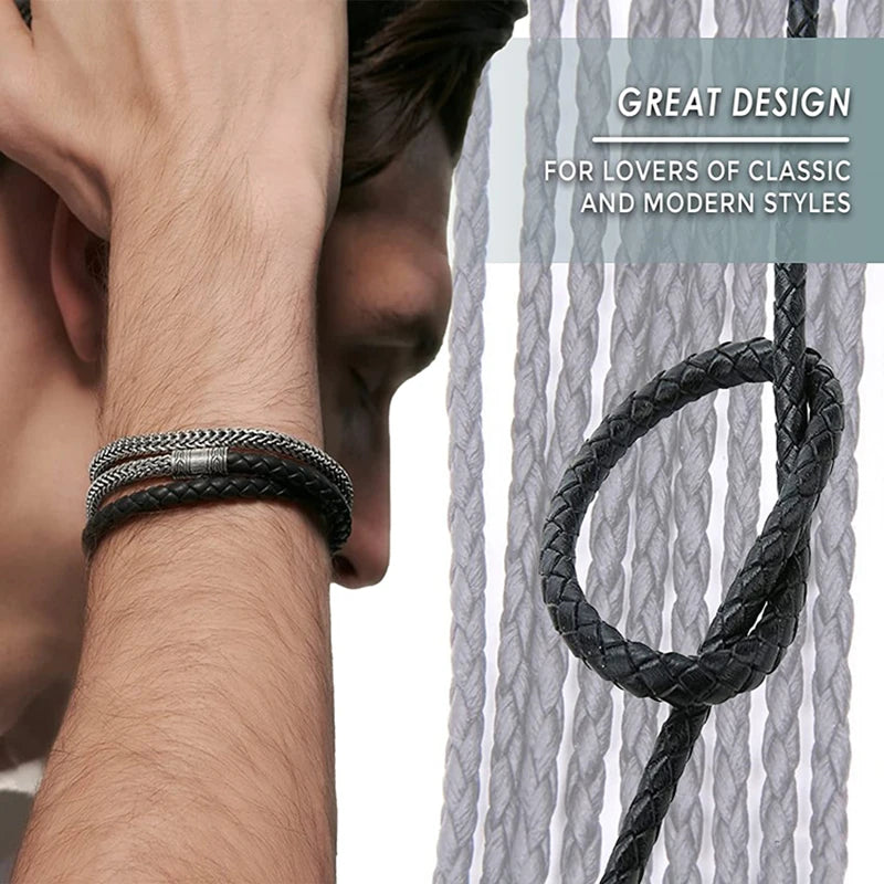 A close-up of a hand wearing a black braided leather cord bracelet against a gray striped background.