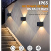 Outdoor wall light fixtures illuminating stone stairs with a waterproof design for adverse weather protection