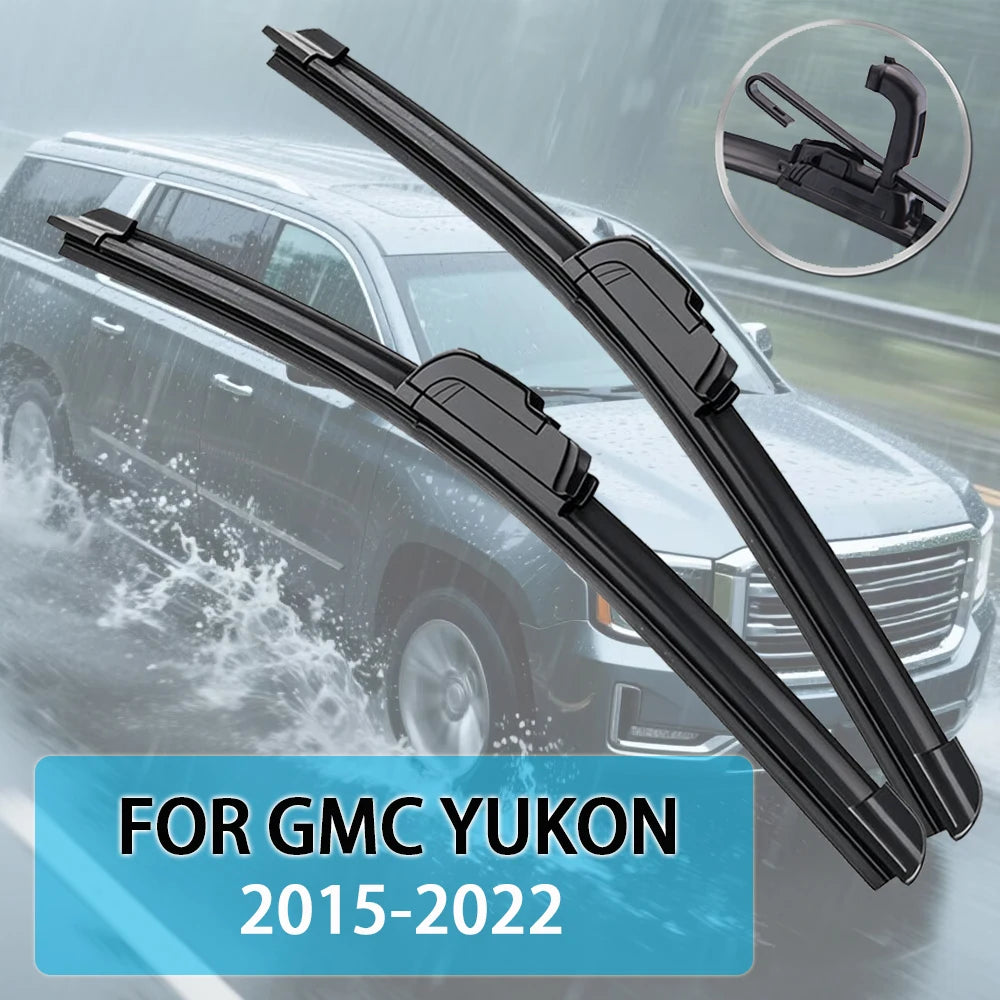 A pair of black windshield wiper blades for a GMC Yukon, shown against a blurred vehicle background.