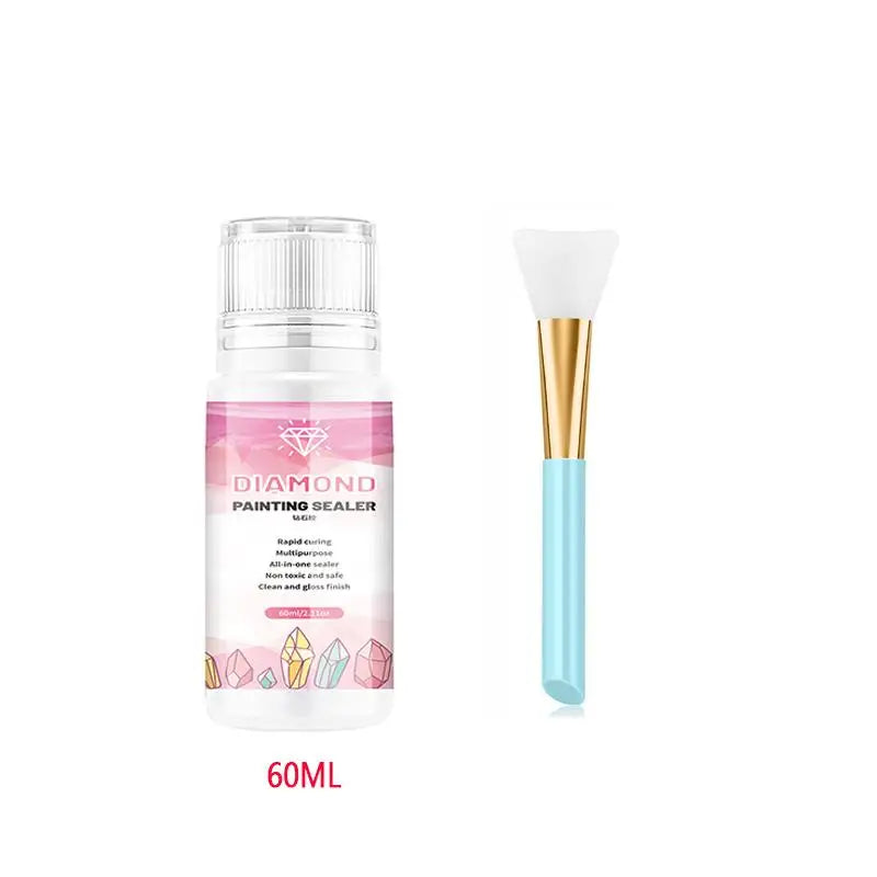 A bottle of Diamond Painting Sealer with a white cap and a gold-colored brush applicator.