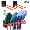 Two black wall mounts with orange handles and a set of five garden tools displayed below.