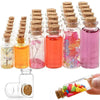 A collection of mini glass bottles with cork stoppers filled with colorful liquids and dried botanicals for DIY crafts