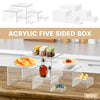 Six clear acrylic five-sided boxes used as stackable display risers for food and desserts