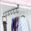 A black under-shelf cup and utensil holder with six hooks is displayed on a white shelf.