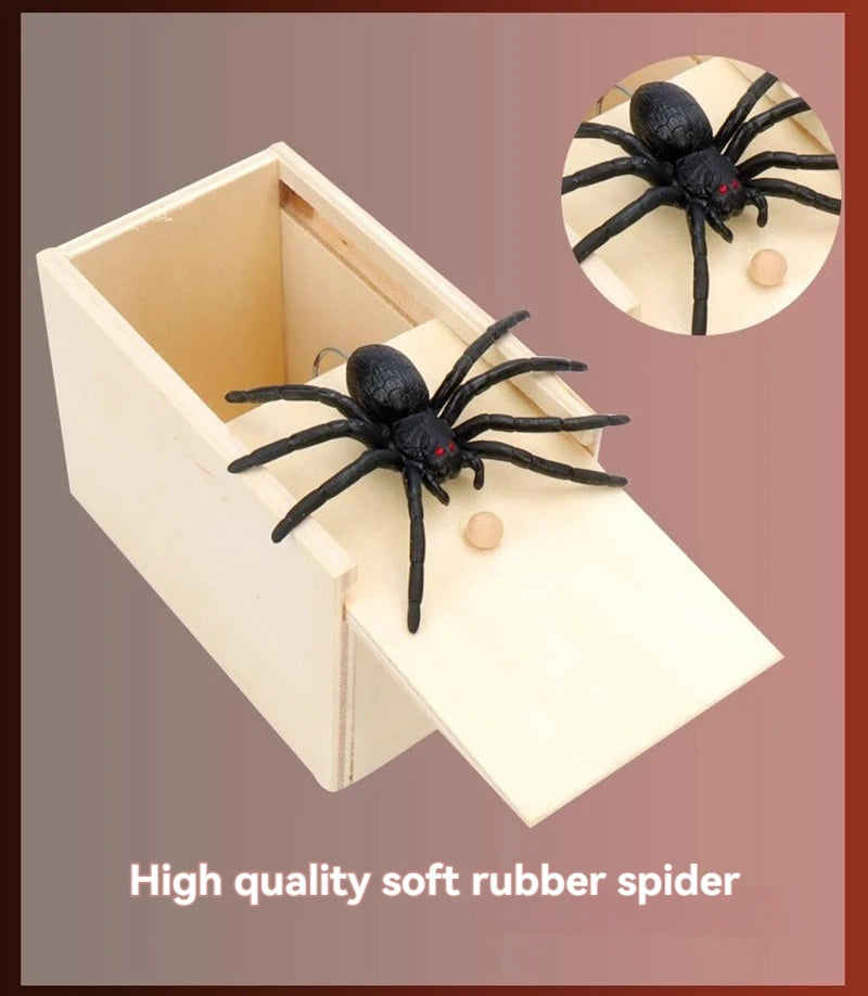 A wooden box containing a black rubber spider and another spider on a circular background.