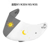 A motorcycle helmet visor lens shield with a gray and white design featuring a sun and crescent moon motif.