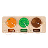 A wooden busy board featuring three fruit shapes: orange, watermelon, and kiwi fruit.