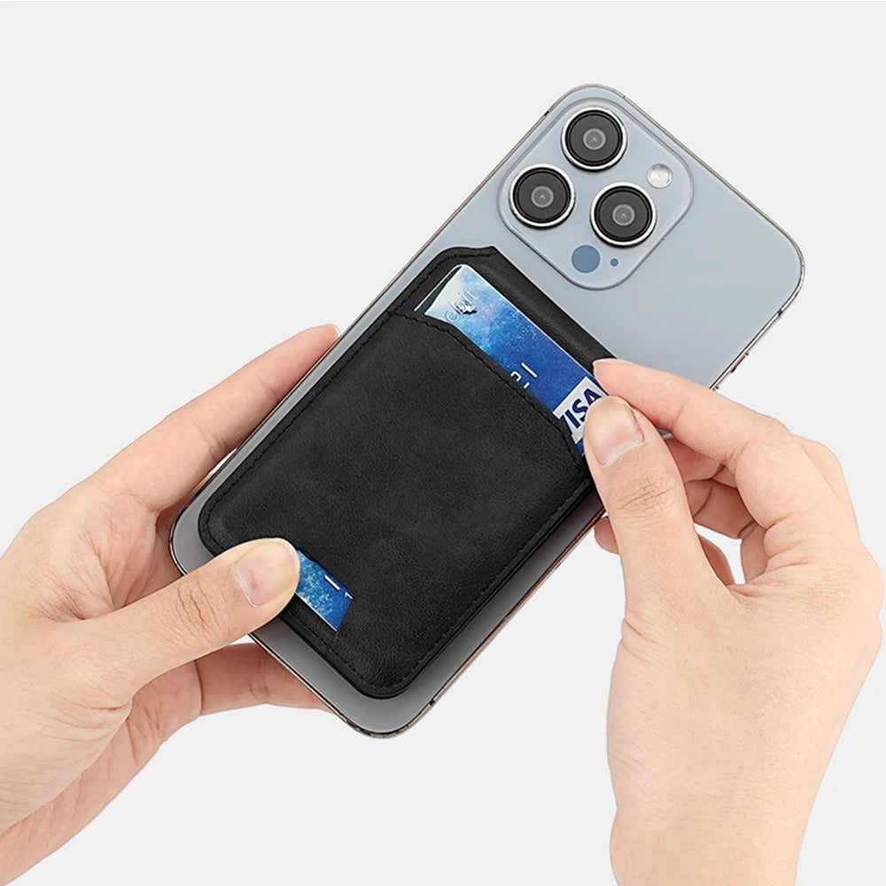 A hand holds a magnetic leather wallet case for an iPhone, showing the card holder inside.