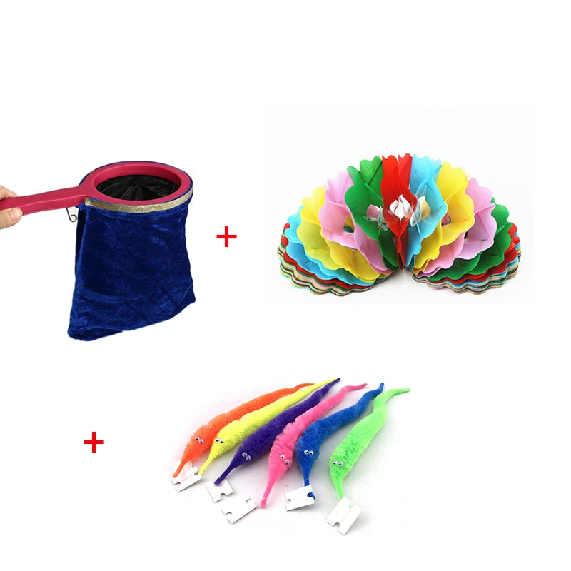 A set of beginner magic trick props including a blue velvet bag and colorful fabric flowers.