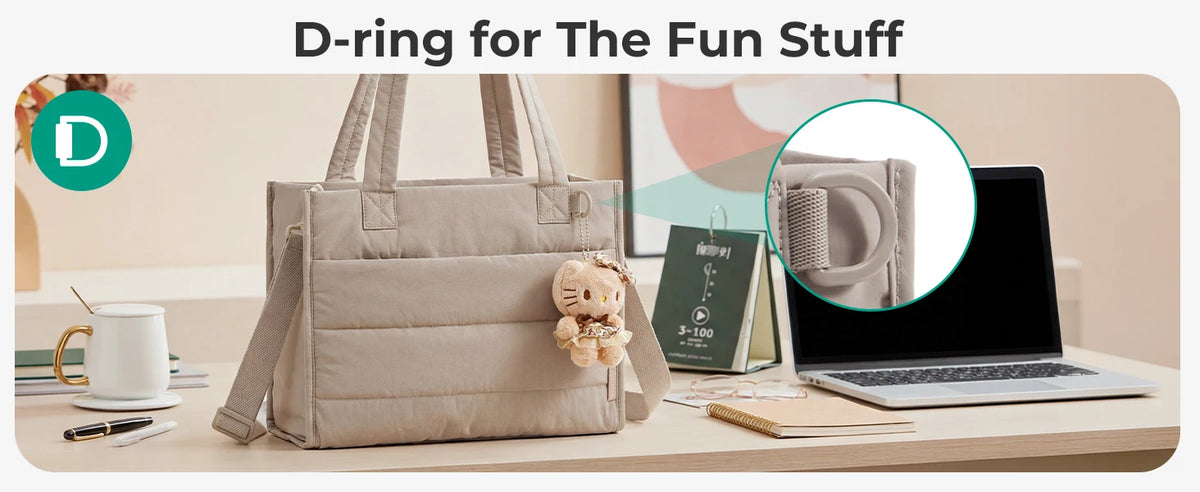 A beige boxy tote bag is shown next to a laptop and stationery, demonstrating the D-ring feature for fun stuff.