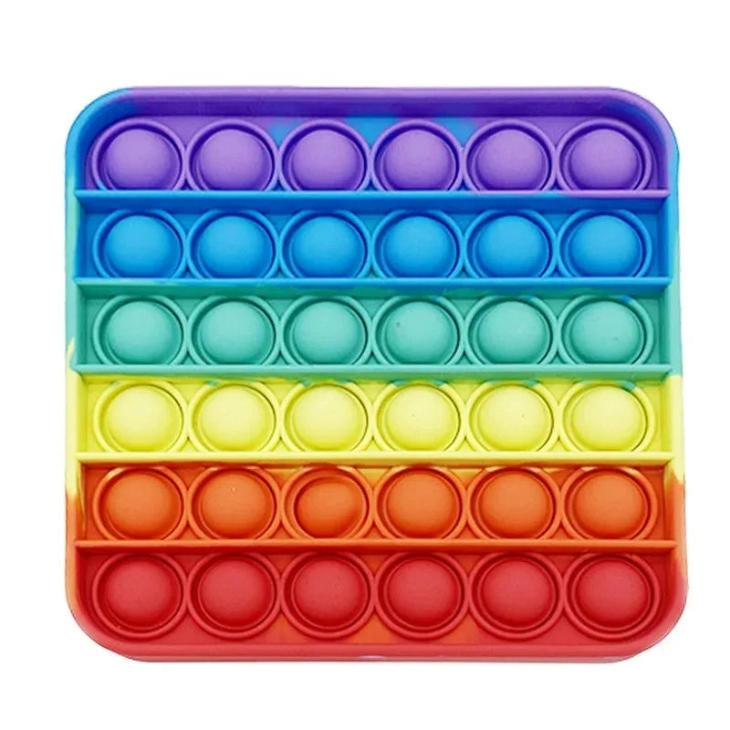 A colorful plastic fidget toy with multiple compartments in rainbow colors for sensory stress relief.