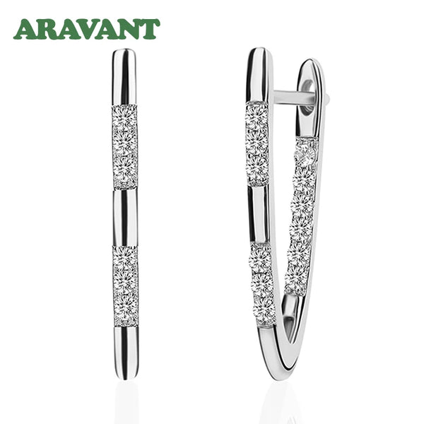 Boucles d'oreilles créoles dorées argent avec des accents de diamants pavés